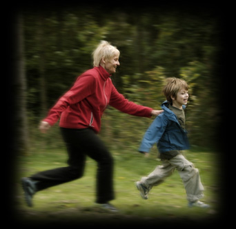 image of a grandmother chasing her grandson